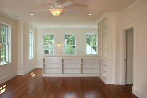 living room or bedroom remodel with built-in shelving